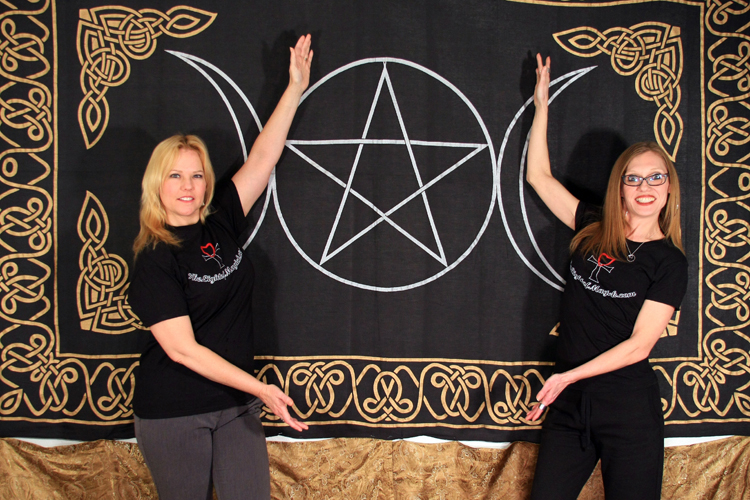 Ginger and Morgana posing in front of the Triple Goddess Pentacle